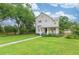 A beautiful front yard with a lush lawn leads up to this two-story house at 14006 5Th St, Dade City, FL 33525