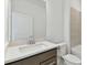 Bathroom featuring a single vanity with quartz countertop, toilet and tile flooring at 20783 Balsam Hill Rd, Land O Lakes, FL 34638