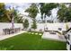 Spacious backyard with patio, seating area, and lush landscaping at 2506 N Highland Ave, Tampa, FL 33602