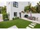 Private backyard with artificial turf and patio furniture at 2506 N Highland Ave, Tampa, FL 33602