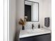 Modern powder room with black and white vanity and sleek mirror at 2506 N Highland Ave, Tampa, FL 33602