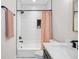 Bathroom with hexagon tile shower and polka dot shower curtain at 2506 N Highland Ave, Tampa, FL 33602
