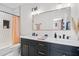 Modern bathroom with a double vanity, hexagon tile shower, and a freestanding tub at 2506 N Highland Ave, Tampa, FL 33602