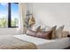 Calm bedroom with large window, neutral tones, and stylish decor at 2506 N Highland Ave, Tampa, FL 33602