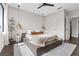 Tranquil bedroom with a platform bed, neutral tones, and natural light at 2506 N Highland Ave, Tampa, FL 33602