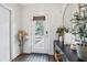 Bright entryway with glass front door and modern console table at 2506 N Highland Ave, Tampa, FL 33602