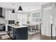 Modern kitchen with island, stainless steel appliances, and white cabinetry at 2506 N Highland Ave, Tampa, FL 33602
