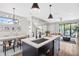 Open concept kitchen with island and breakfast bar, features modern appliances at 2506 N Highland Ave, Tampa, FL 33602