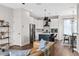 Modern white kitchen with island and stainless steel appliances at 2506 N Highland Ave, Tampa, FL 33602