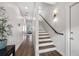 Modern staircase with wood steps and a metal railing at 2506 N Highland Ave, Tampa, FL 33602