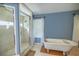 Bathroom with soaking tub, walk-in shower, and tiled floors at 4502 Hill Dr, Valrico, FL 33596