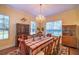 Formal dining room with hardwood floors, large table, and china cabinets at 4502 Hill Dr, Valrico, FL 33596