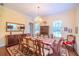 Elegant dining room featuring a large table, chandelier, and hardwood floors at 4502 Hill Dr, Valrico, FL 33596
