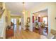 Bright and spacious entryway with hardwood floors and views to other rooms at 4502 Hill Dr, Valrico, FL 33596