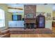 Brick fireplace with built-in shelving and a large mantel at 4502 Hill Dr, Valrico, FL 33596