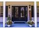 Elegant double front doors with glass panels and sidelights at 4502 Hill Dr, Valrico, FL 33596
