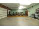 Large garage converted into a music studio, featuring a stage and equipment at 4502 Hill Dr, Valrico, FL 33596