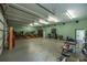 Large garage converted into a music studio, featuring a stage and equipment at 4502 Hill Dr, Valrico, FL 33596