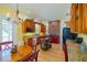 Kitchen features a red range, wood cabinets, granite counters, and a breakfast nook at 4502 Hill Dr, Valrico, FL 33596