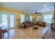 Spacious living room with hardwood floors, fireplace, and comfortable seating at 4502 Hill Dr, Valrico, FL 33596