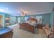 Large main bedroom with a king-size bed and sitting area at 4502 Hill Dr, Valrico, FL 33596