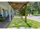 Covered patio with pergola, brick pavement, and seating at 4502 Hill Dr, Valrico, FL 33596