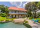 Relaxing pool area with lounge chairs and a pergola at 4502 Hill Dr, Valrico, FL 33596