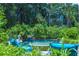 Comfortable seating area overlooking the pool and lush landscaping at 4502 Hill Dr, Valrico, FL 33596