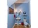 Small powder room with pedestal sink, toilet, and decorative accents at 4502 Hill Dr, Valrico, FL 33596