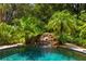 Serene waterfall feature in a lush tropical setting at 4502 Hill Dr, Valrico, FL 33596