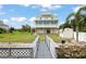 Elevated home with a large backyard, detached shed, and private dock at 8932 Rocky Creek Dr, Tampa, FL 33615