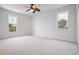 Spacious bedroom with carpeted floor and ceiling fan at 8932 Rocky Creek Dr, Tampa, FL 33615