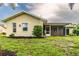 Home exterior showcasing a screened patio and grassy backyard at 1501 63Rd W St, Bradenton, FL 34209