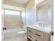 Updated bathroom with new vanity, bathtub, and tiled floors at 1501 63Rd W St, Bradenton, FL 34209