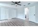 Bright bedroom with wood-look floors, double closets, and access to bathroom at 1501 63Rd W St, Bradenton, FL 34209