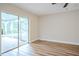 Bedroom with hardwood floors, sliding glass doors to patio at 1501 63Rd W St, Bradenton, FL 34209