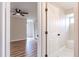 Bedroom with hardwood floors and en-suite bathroom access at 1501 63Rd W St, Bradenton, FL 34209