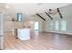 Open concept living area with wood beams and flooring at 1501 63Rd W St, Bradenton, FL 34209