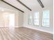 Bright living room with wood beams and hardwood floors at 1501 63Rd W St, Bradenton, FL 34209