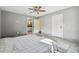 Main bedroom with ensuite bathroom and grey walls at 28628 Bennington Dr, Wesley Chapel, FL 33544