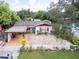 Quaint house with stone patio and covered parking at 315 E Seneca Ave, Tampa, FL 33612