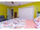 Bedroom with coral bedding and built-in closet at 315 E Seneca Ave, Tampa, FL 33612