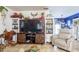 Spacious living area with large TV and built-in shelving at 315 E Seneca Ave, Tampa, FL 33612