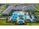 Aerial view of the community clubhouse with pools and resort-style amenities at 4838 Sevilla Shores Dr, Wimauma, FL 33598