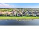 Tranquil lake view, with beautiful aerial views of the community and single Gathering homes at 4838 Sevilla Shores Dr, Wimauma, FL 33598