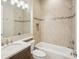 Bathroom featuring tile shower, soaking tub, and vanity at 4838 Sevilla Shores Dr, Wimauma, FL 33598