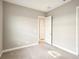 Bright bedroom features neutral paint and carpet at 4838 Sevilla Shores Dr, Wimauma, FL 33598