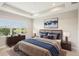 Tastefully decorated bedroom features ample natural light and luxurious furnishings, creating a cozy retreat at 4838 Sevilla Shores Dr, Wimauma, FL 33598