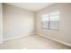 Neutral bedroom with bright window and carpet at 4838 Sevilla Shores Dr, Wimauma, FL 33598