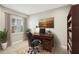 Bright office with large window and built-in bookshelves at 4838 Sevilla Shores Dr, Wimauma, FL 33598